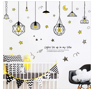 Detail of creative hanging lamp wall stickers with stars and moon in a kid's bedroom