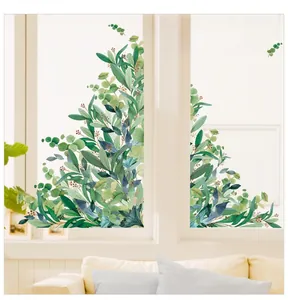 Detail of eucalyptus leaf wall stickers with poetic text on a bright window background