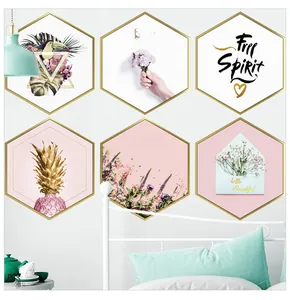 Detail of pink Nordic hexagonal wall stickers with tropical plants and gold frames