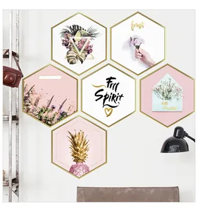 Detail of six-piece hexagonal wall art set with tropical toucan and golden pineapple