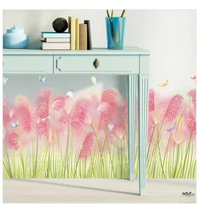 Detail view of pink reed wall stickers with butterflies on a clean bedroom wall surface