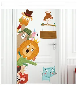 Detail of colorful cartoon giraffe and lion wall stickers on a white interior door