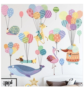 Detail of cartoon animal wall decals featuring elephants and giraffes for nursery decor