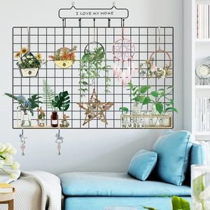 Nordic black iron wall grid organizer with home decor accessories and hooks