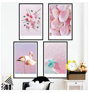 Close-up of four-piece Nordic pink wall art featuring flamingos, shells and beach theme