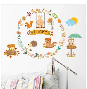 Detailed bedroom wall scene with cartoon rabbit and fox stickers on a white wall