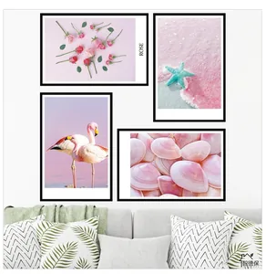 Set of four Nordic pink flamingo and beach shell wall art prints in black frames
