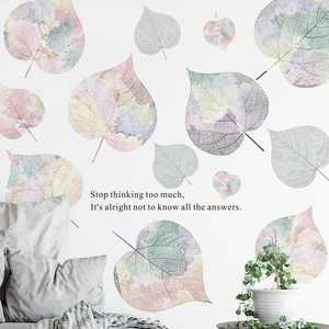 Morandi watercolor leaf wall stickers with inspirational text in a cozy bedroom setting