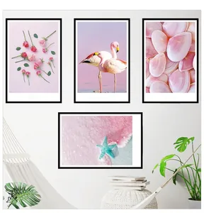 Set of four modern wall art frames featuring flamingos, shells and roses in pink