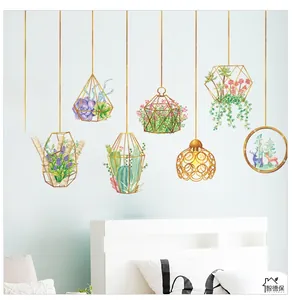 Close-up of watercolor succulent plant terrarium wall stickers on a bedroom wall