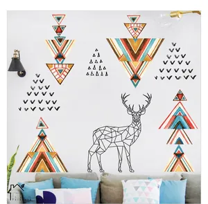 Detail of geometric deer and triangle wall stickers in minimalist Bohemian style