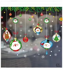 Close-up of Santa Claus and snowman Christmas window decals with vibrant festive colors