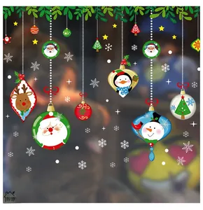 Detail view of festive Christmas window stickers with Santa, snowman and reindeer designs