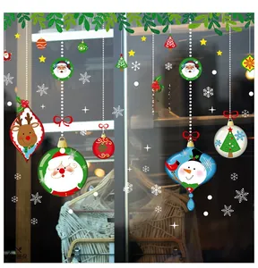 Detail view of festive Christmas window stickers featuring Santa, reindeer, and snowman