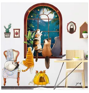 Detail of creative cat wall stickers with night sky window view and potted cacti decor