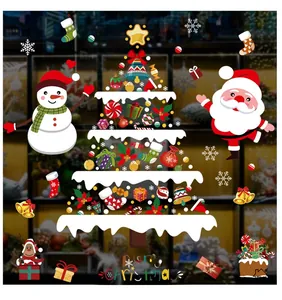 Detail of Christmas snowman and gift tree window stickers with Merry Christmas text