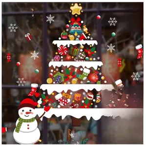 Close-up of Merry Christmas window stickers with festive snowman and creative tree