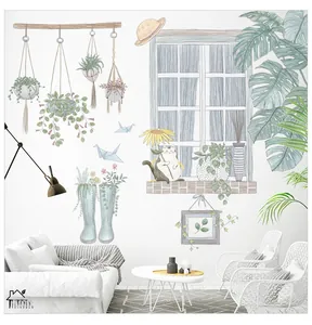 Detail of Nordic style cat and potted plant wall decals on a modern living room wall