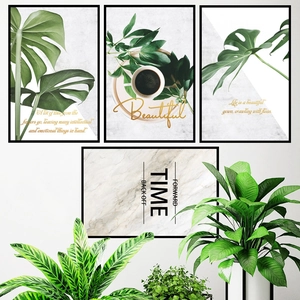 Set de tableaux déco nordiques avec feuilles de monstera et cadres noirs élégants