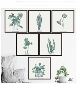 Détail d'un ensemble de tableaux muraux Monstera avec cadres noirs au style nordique