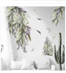 Detailed view of Nordic style green leaf wall decals applied on a white living room wall