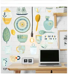 Close-up of waterproof kitchen wall stickers with hand-drawn cat and lemon motifs
