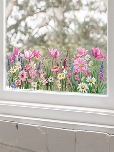 Détail de stickers autocollants tulipes et marguerites appliqués sur une vitre