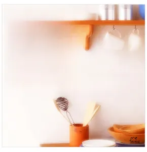 Close-up of no smoking wall sticker with cartoon figure on a white kitchen wall
