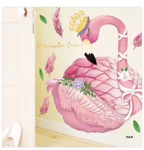 Detail of pink flamingo wall sticker with golden crown and romantic floral accents