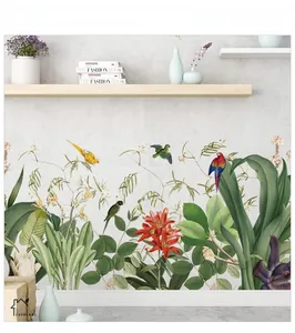 Detail of tropical wall sticker featuring green leaves, red flowers, and exotic birds