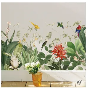 Detail of tropical plant wall stickers with colorful parrots and flowers in home setting