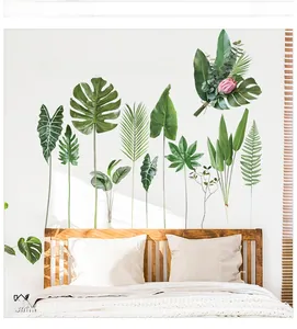Detail of tropical plant wall stickers with Monstera leaves and motivational quote