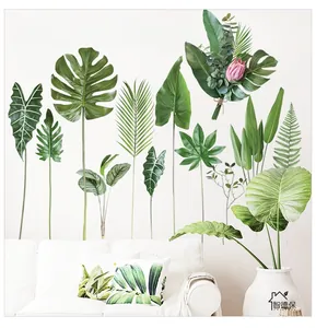 Detail of tropical monstera leaf wall stickers in a minimalist Nordic living room setting