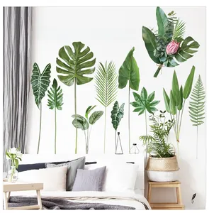 Tropical monstera leaf wall sticker with inspirational quote in a bedroom setting
