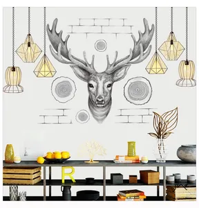 Detail of Nordic wall sticker featuring a sketched elk head and warm geometric hanging lamps