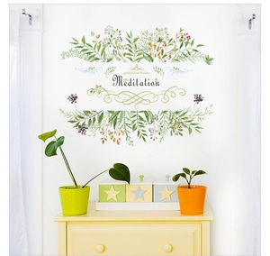 Detail of green leaf wall sticker with Meditation text and vine decorative elements