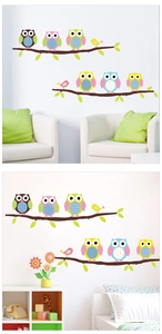 Detailed view of colorful cartoon owl wall stickers on nursery walls for home decoration