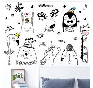 Detail of hand-drawn animal wall stickers showing rabbit and deer in a cozy bedroom setting