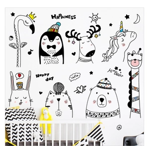 Detail of cartoon animal wall stickers including flamingo and giraffe in a cozy nursery