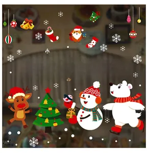 Detailed view of Merry Christmas window decals with snowmen and reindeer on glass
