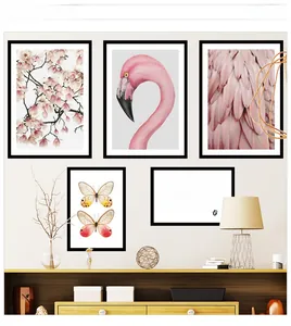 Set of 5 minimalist wall art prints featuring pink flamingos and floral motifs in black frames