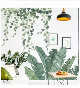 Detail view of waterproof PVC tropical banana leaf and ivy wall stickers in a modern room