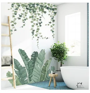 Detail of tropical banana leaf and hanging ivy wall decals in a modern bathroom setup