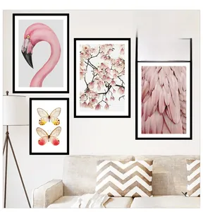 Detailed view of flamingo and floral wall art set with pink feathers and wild thing text