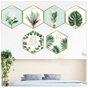 Detail of 6-piece hexagonal Nordic wall art set with green plants and gold frames
