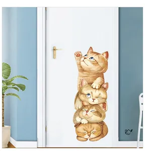 Detail view of cute orange 3D cartoon cats climbing a ladder on a white bedroom door