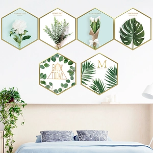 Modern hexagonal wall decor set with gold frames and botanical prints for living room