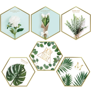 Modern hexagonal botanical wall art stickers with green floral motifs and gold frames