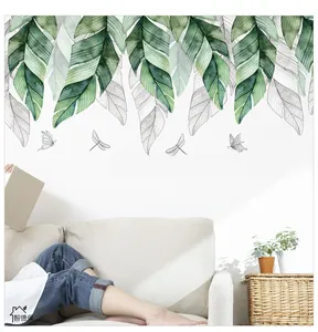 Detail of hand-painted banana leaves and insect wall stickers with inspirational quote