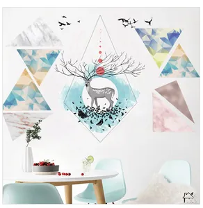 Detail of Nordic wall stickers with geometric marble triangles and artistic elk silhouette
